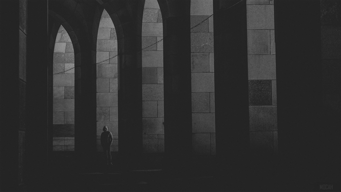 Lonely figure in stone arches, black and white 4K
