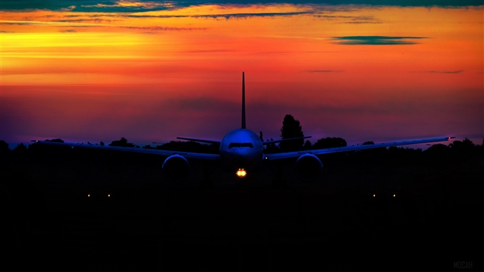Airplane on runway at sunset 4K
