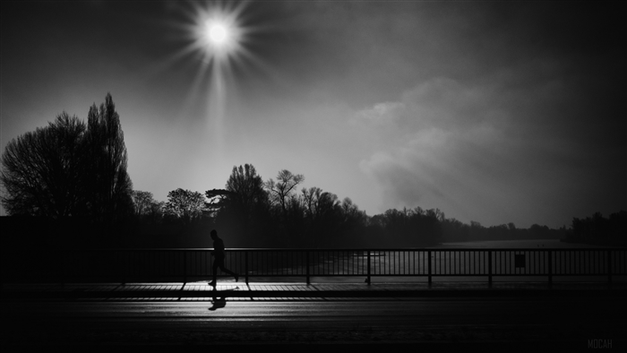 Silhouette Running on Bridge Under Sunlight 4K