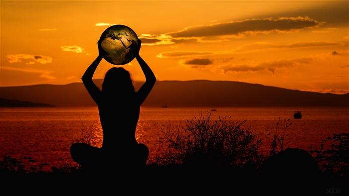 Silhouette holding Earth at sunset 4K