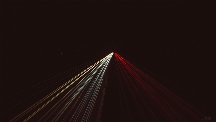 Light trails on a dark highway 4K
