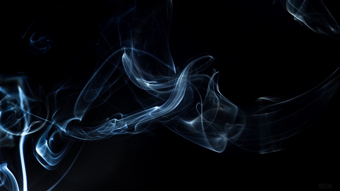 Wisps of smoke against a dark background