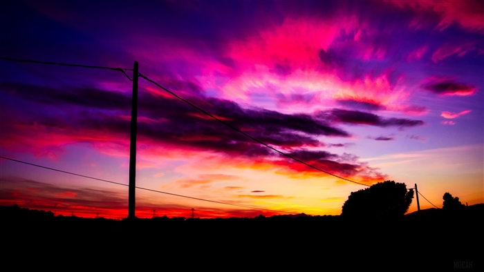 Sunset sky with clouds and power lines