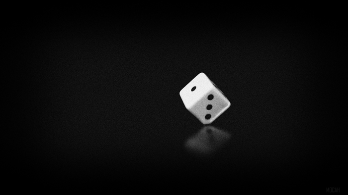 Black and white image of a die with 1 and 3 dots