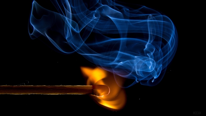Match burning with blue smoke