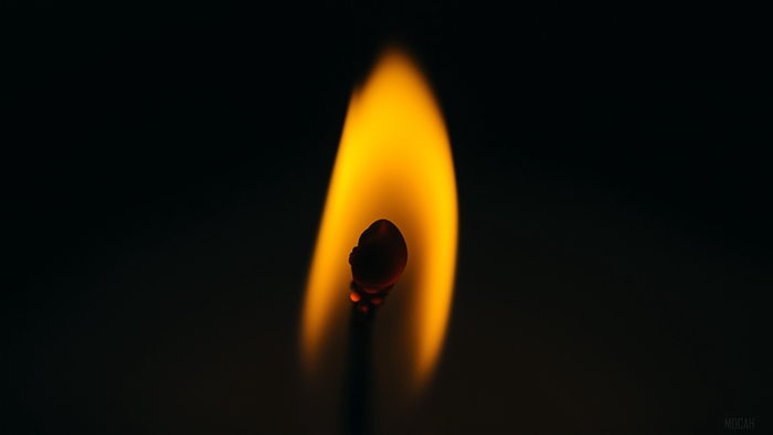 Close-up of a burning match in the dark 4K