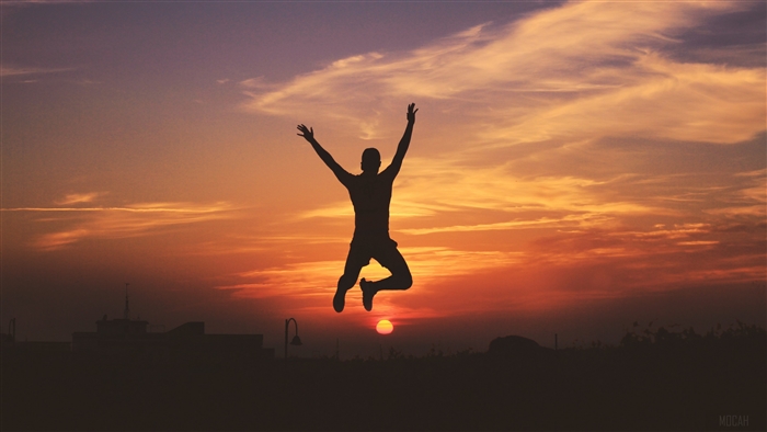 Man jumping at sunset silhouette 4K