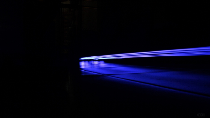 Blue light streaks on a dark road