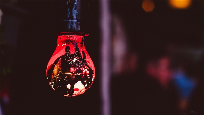 Red stained light bulb with cracks