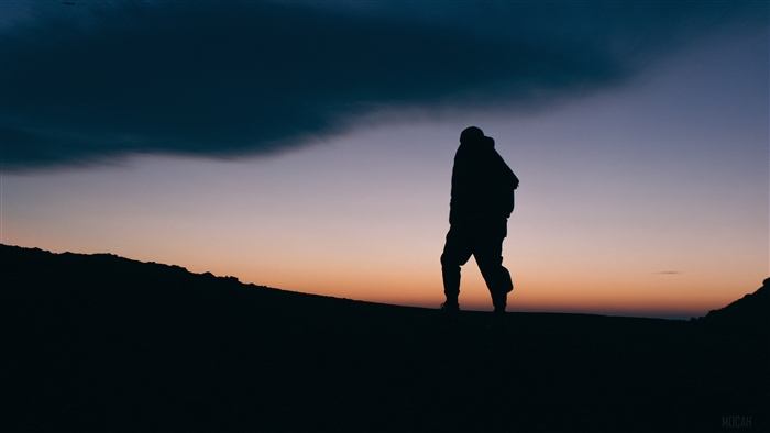 Silhouette of Man at Dusk with Dramatic Sky 4K