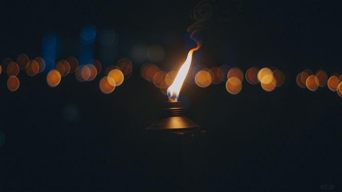 Torch with flame and bokeh lights