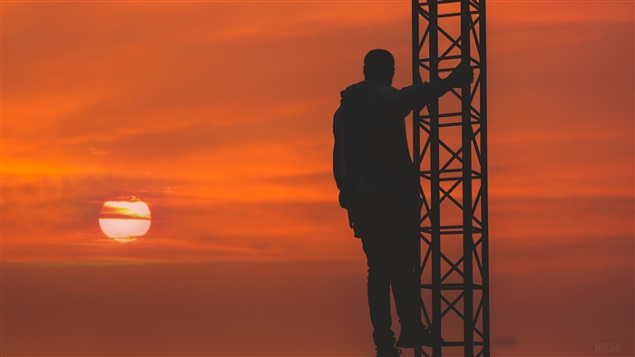 Man climbing tower at sunset 4K