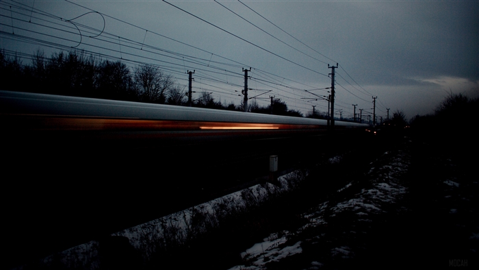Train at night with overhead wires 4K