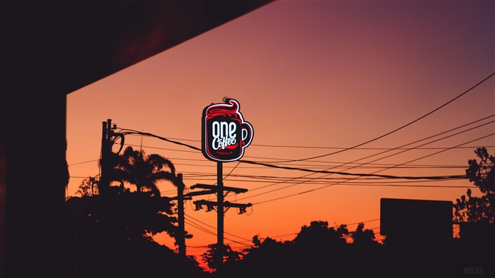 One Coffee Cafeteria signboard at sunset