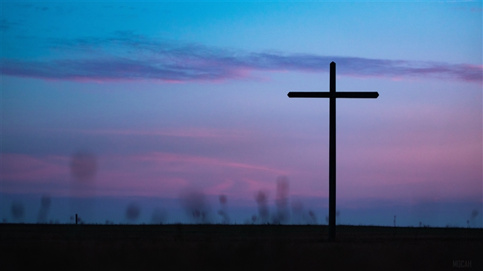 Cross on the horizon at sunset 4K