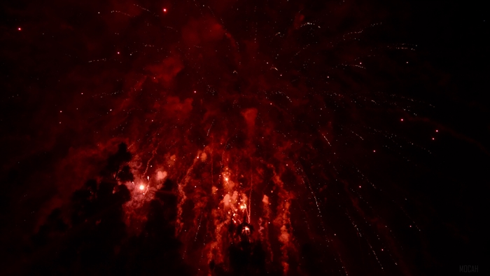 Red Fireworks in the Night Sky 4K