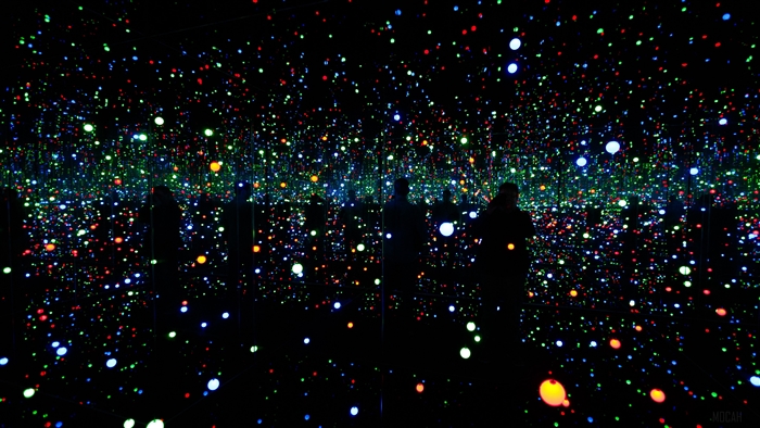 Infinity room with colorful lights and silhouettes