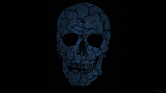 Cracked skull with starry texture on black background
