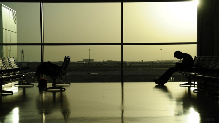 Man waiting at airport terminal 4K