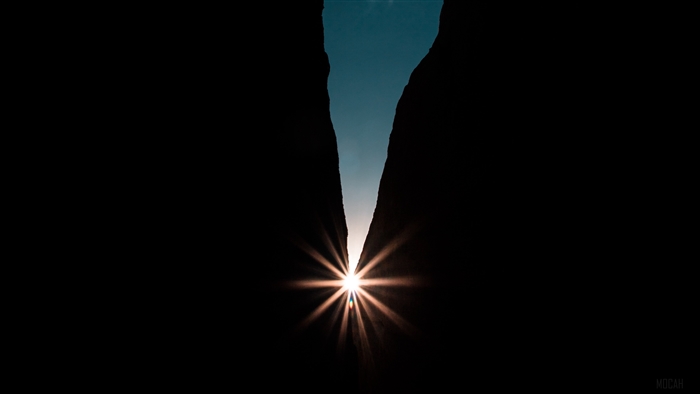 Sunburst through a narrow canyon opening