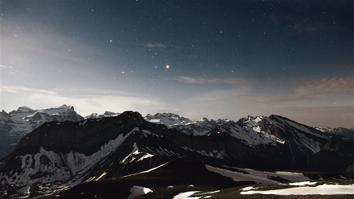 Starry Night Sky Over Snow-Capped Mountains 4K