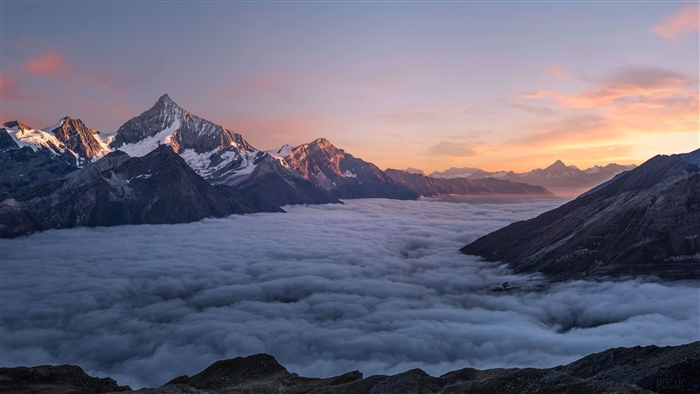 Mountains Above Clouds at Sunrise