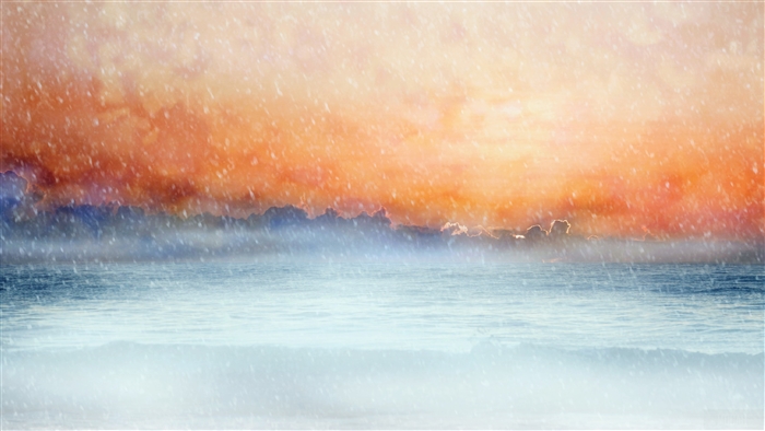 Ocean under orange clouds with falling snow