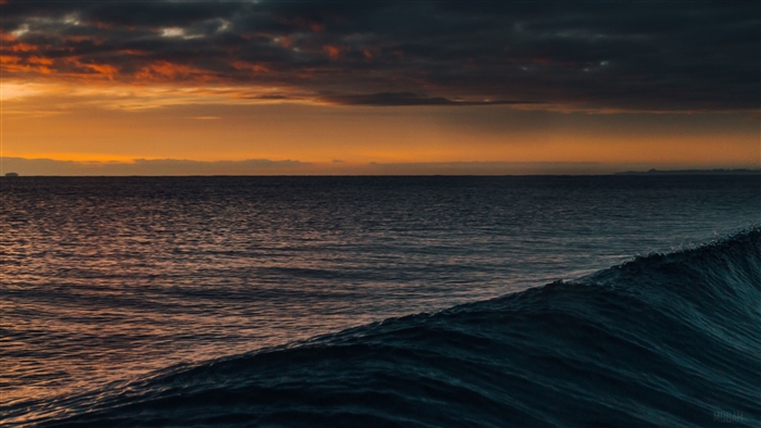 Dark Orange Sunset Over Ocean Waves 4K