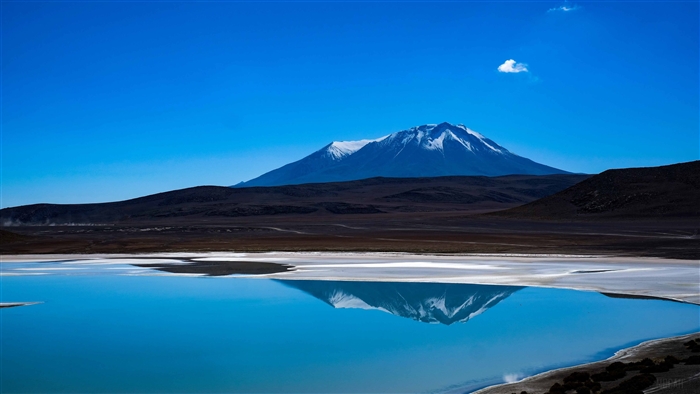 Blue Lake with Snow-Capped Mountain Reflection