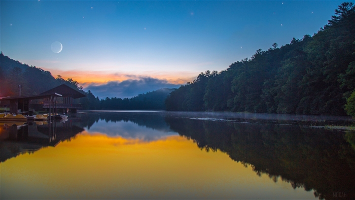 Crescent Moon Over Misty Lake and Forest at Dawn