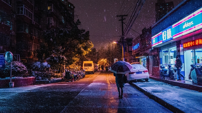Snowy Night Street with People and Storefronts 4K