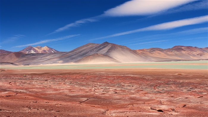 Desert landscape with mountains and a person