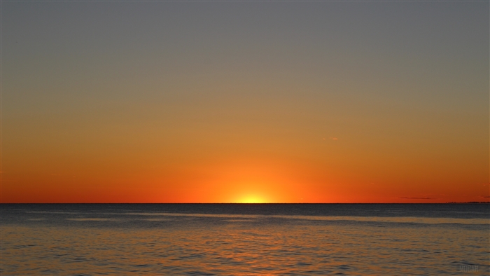 Sunset over the ocean at dusk