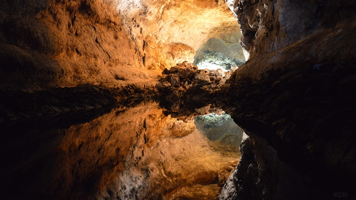 Cave with water reflection