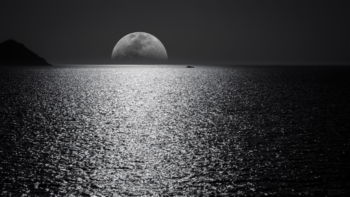 Moon over the ocean with a boat and island