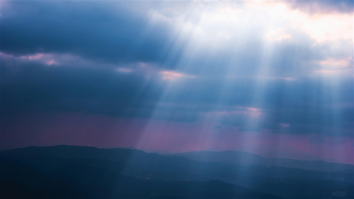 Sunlight Rays Through Clouds Over Mountains 4K