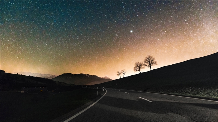Road under a sky full of stars