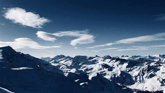Snowy Mountains Under a Blue Sky