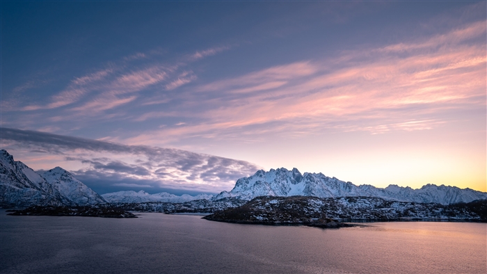 Snowy Mountains Over Water at Sunset 4K
