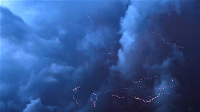 Lightning strikes in a dark thunderstorm sky