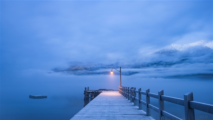 Winter landscape with a pier and mountains