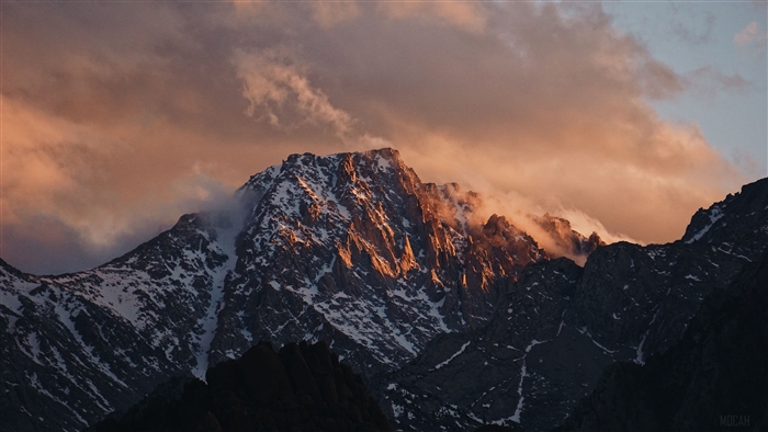 Mountain Peak at Sunset with Clouds