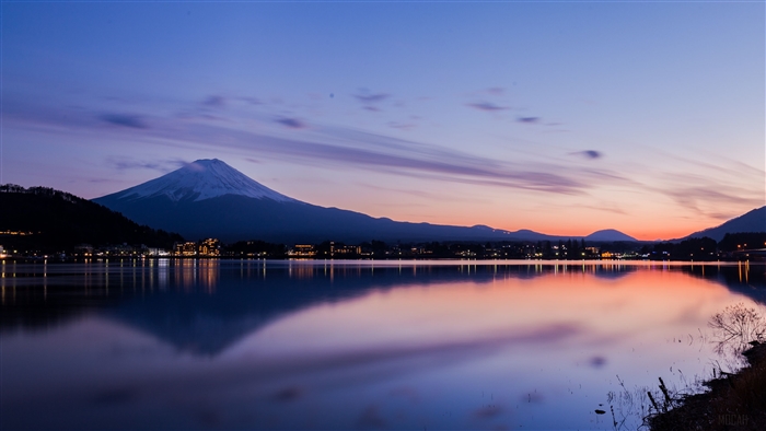 Mount Fuji reflected in Lake Kawaguchi at dusk