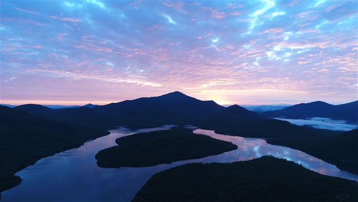 Sunset over mountains and lake 4K