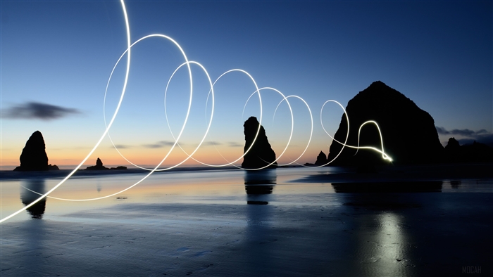Light Painting Art on Beach at Dusk