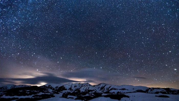 Sky Full of Stars Over Snowy Mountains 4K