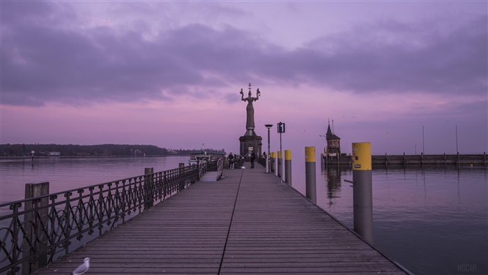 Imperia statue on a pier at Lake Constance during sunset