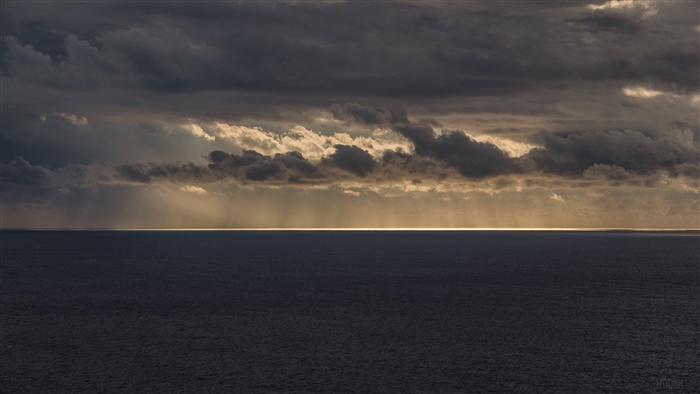 Sea and Sunlight through Clouds 4K
