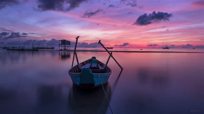 Boat on a calm sea at sunset 4k