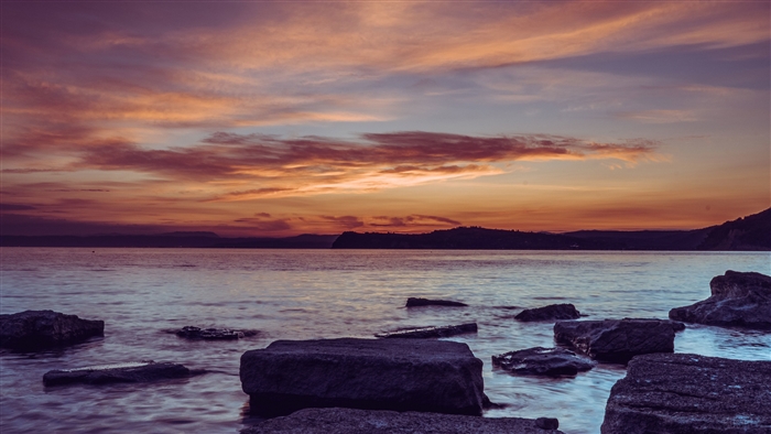 Sunset over the sea with rocks